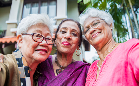 Retired old women taking a group picture together