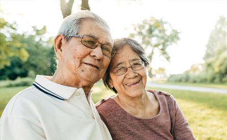 A Filipino older woman and man in park