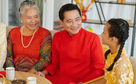 Vietnamese grandparents having tea for Lunar New Year