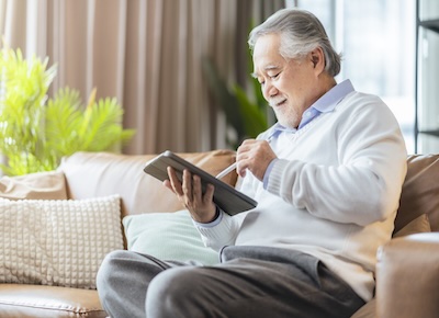 Adult using an tablet to read information